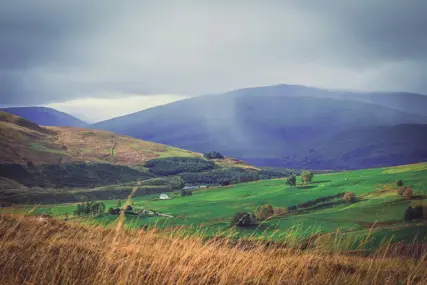 Open moorland running back to low hills