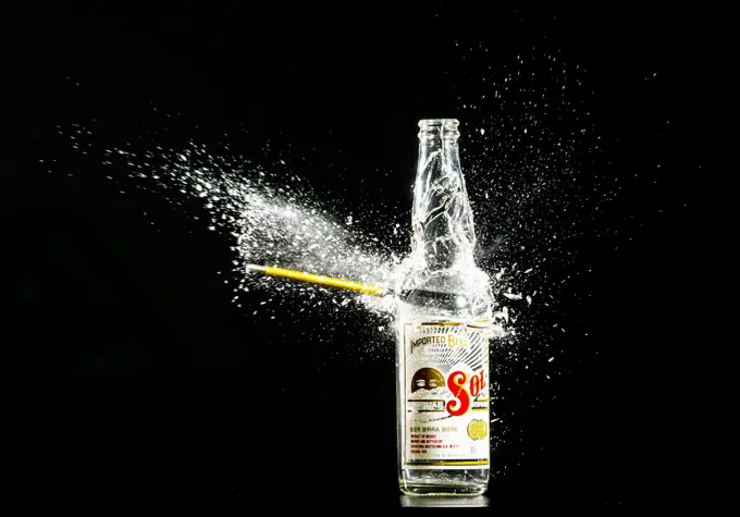 A drink being poured, caught mid-splash