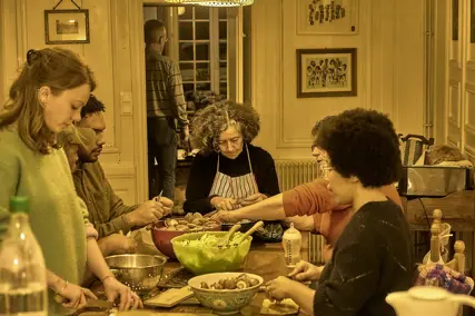 A shared meal being prepared in a community kitchen