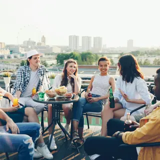 Friends outdoors on a hot afternoon with cold drinks