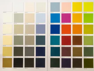 Fabric swatches fanned out by colour