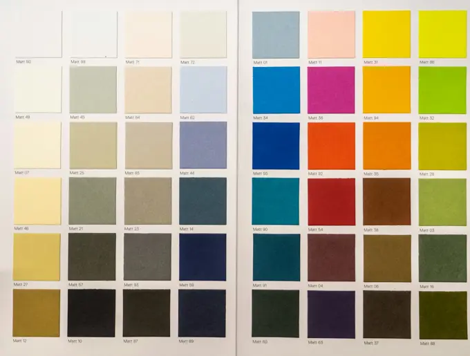 Fabric swatches fanned out by colour