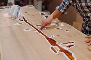A furniture bench mid-job, tools where they were left