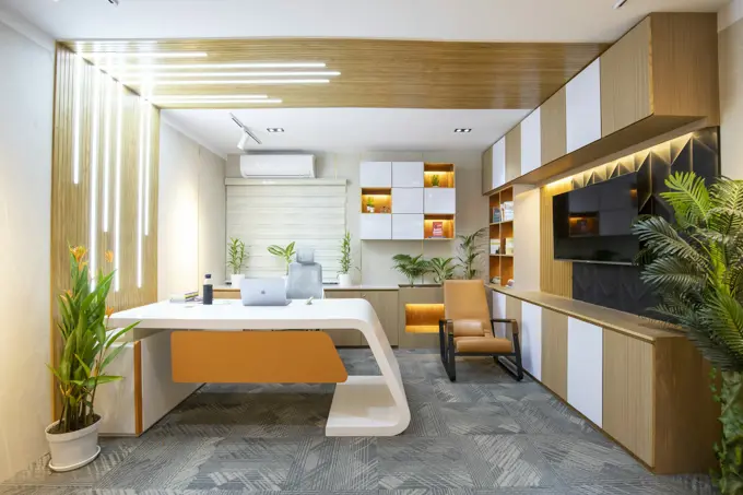 A designer's desk with drawings and samples spread out