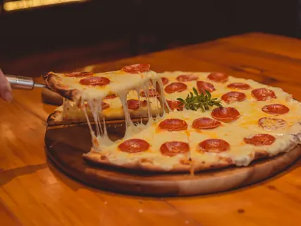 A cut slice lifted clear of the tray