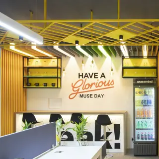 A juice bar counter lined with fruit and glasses