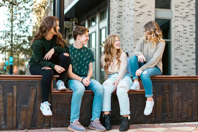 A mentor and a young person talking side by side