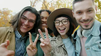 A group of friends sitting outside, talking